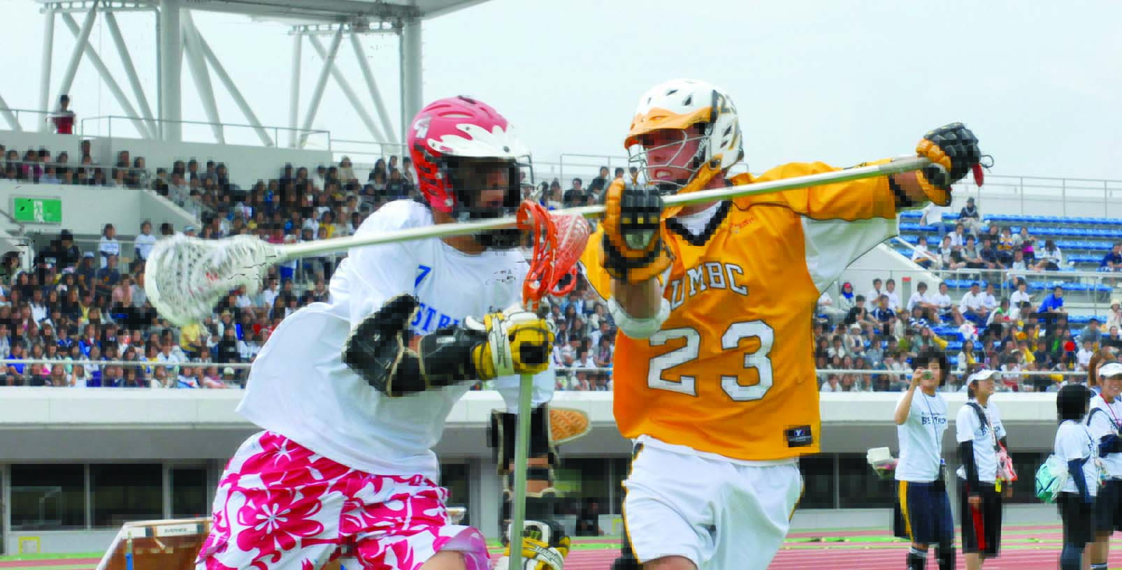 two lacrosse players go head to head Umbc lacrosse players lacrosse stick in front of other player