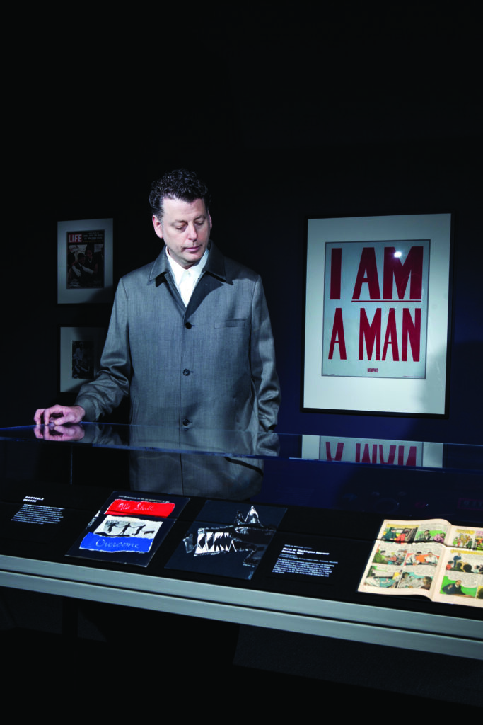 Maurice Berger poses in the "For All The World To See: Visual Culture and the Struggle for Civil Rights" exhibit in the National Museum of African American History and Culture Gallery of the Smithsonian's American History Museum July 27, 2011 in Washington, DC.  The traveling exhibit, which focuses on the power of visual media, is on display to November 27 and is organized by the Center for Art, Design and Visual Culture at the University of Maryland and the National Museum of African American History and Culture
