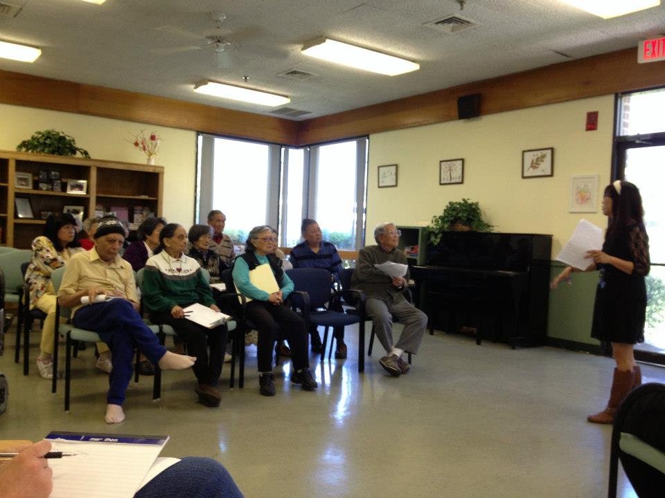 Christine Au speaks with residents