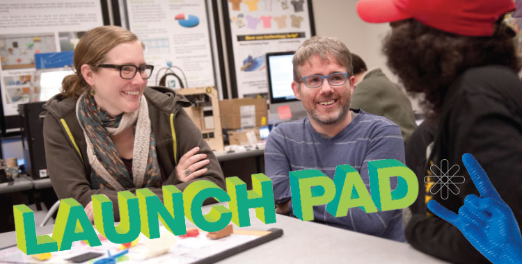 Launch pad with people talking at table