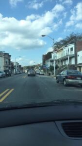 picture through car windshield of street