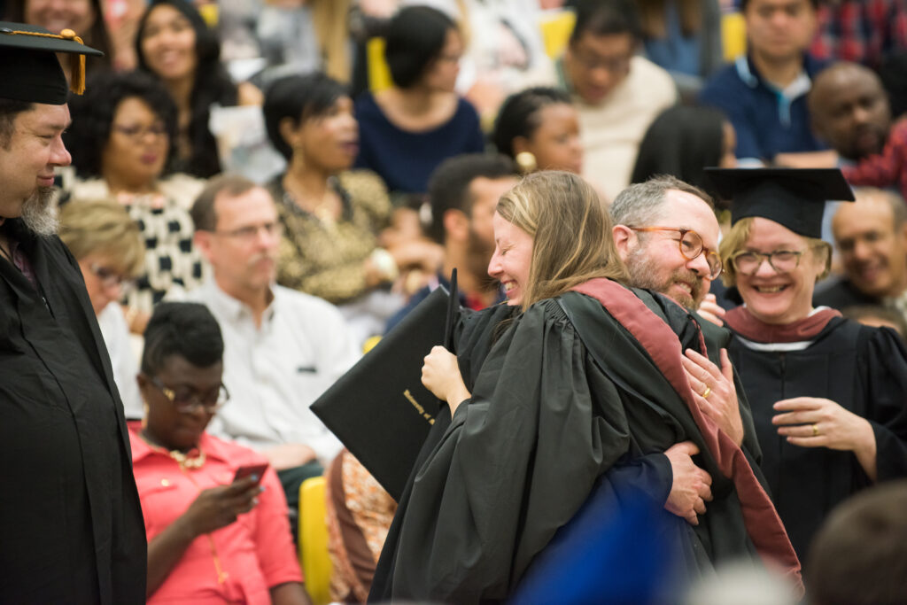 Prof. Tim Nohe congrats Melissa Cormier upon receiving her MFA degree.