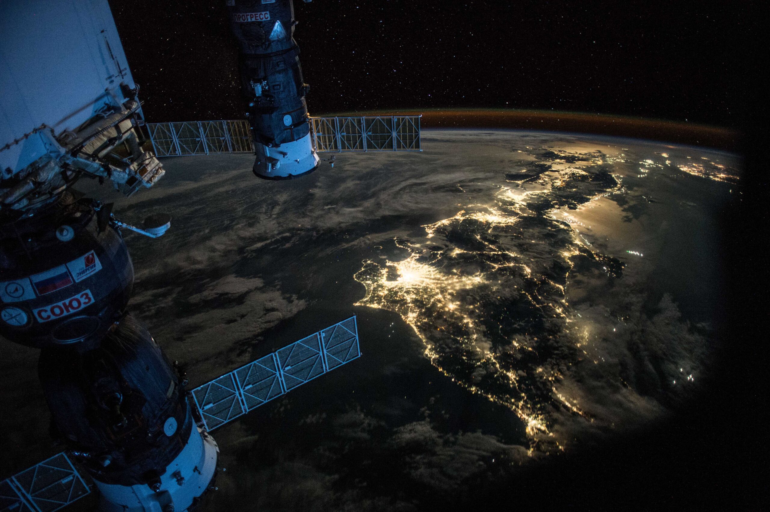 Night Earth observation of Japan taken by Expedition 44 crewmember astronaut Scott Kelly, with a Soyuz Spacecraft connected to the Mini Research Module 1 (MRM1), and a Progress Spacecraft visible. Courtesy of NASA.