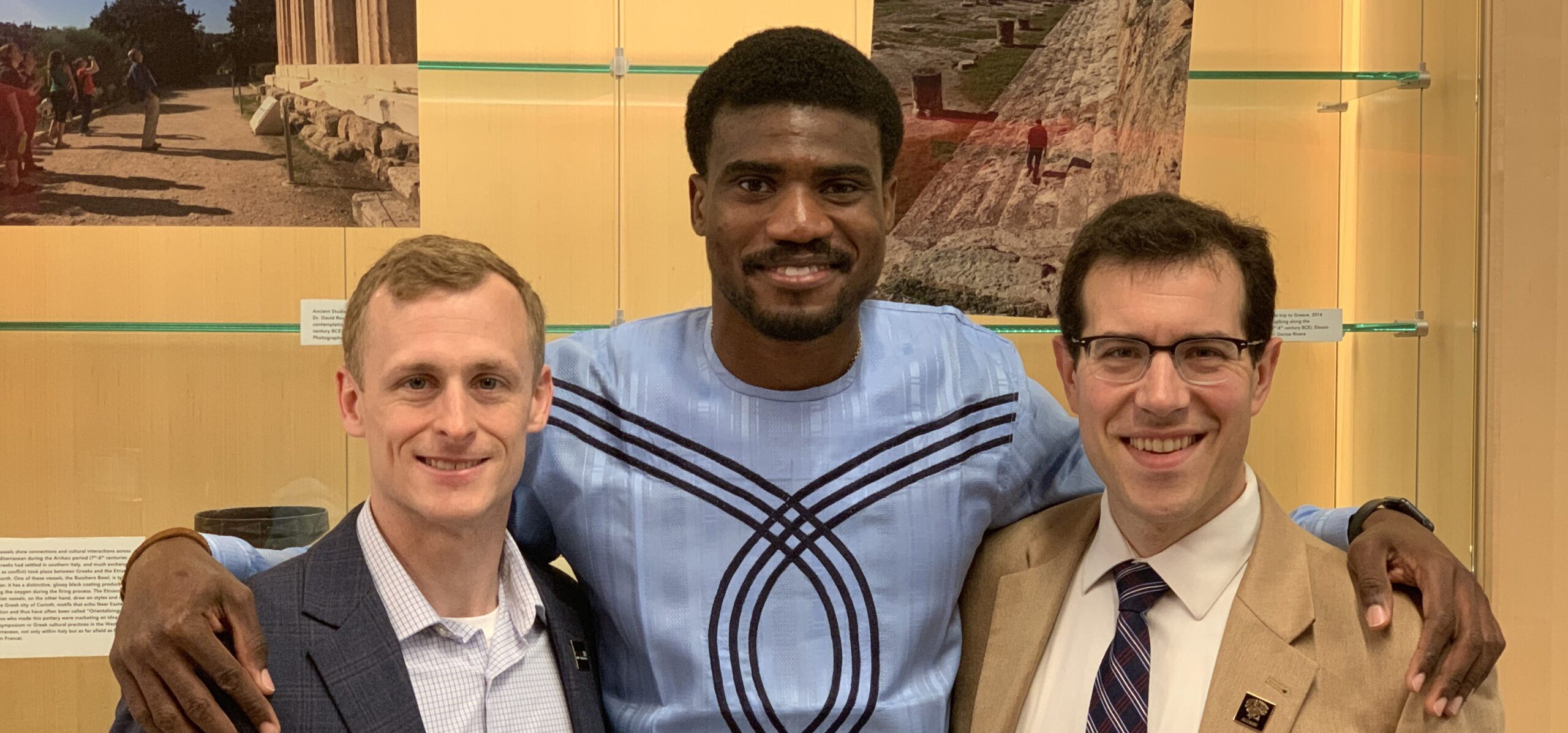Damian Doyle, right, and Ray Soellner, left, the associate director of telecommunications, and Tobi Odunsi, middle, a master's student in cyber security. Photo courtesy of Tobi Odunsi.