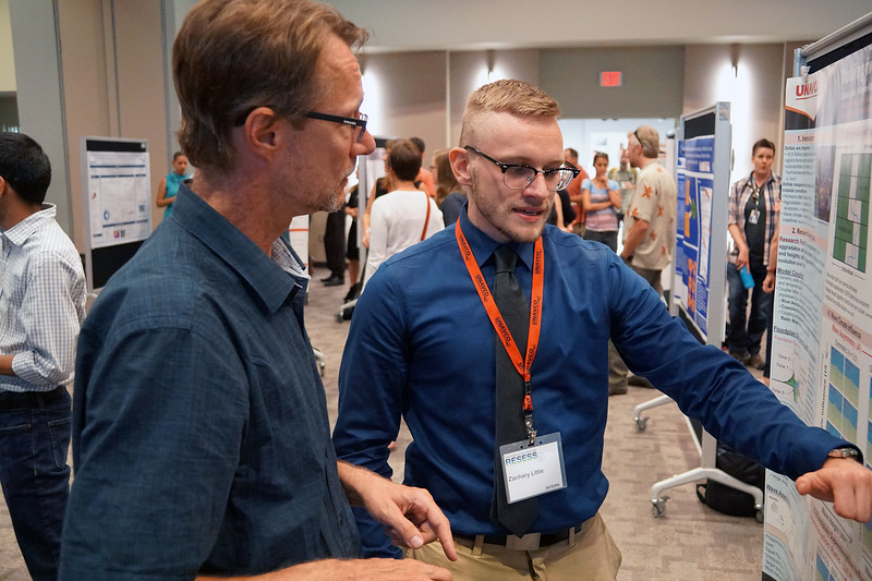 Zachary Little, a 2018 RESESS intern, discusses his summer research with CU Boulders Greg Tucker. August 2, 2018. Boulder, Colorado. (Photo/Daniel Zietlow, UNAVCO)