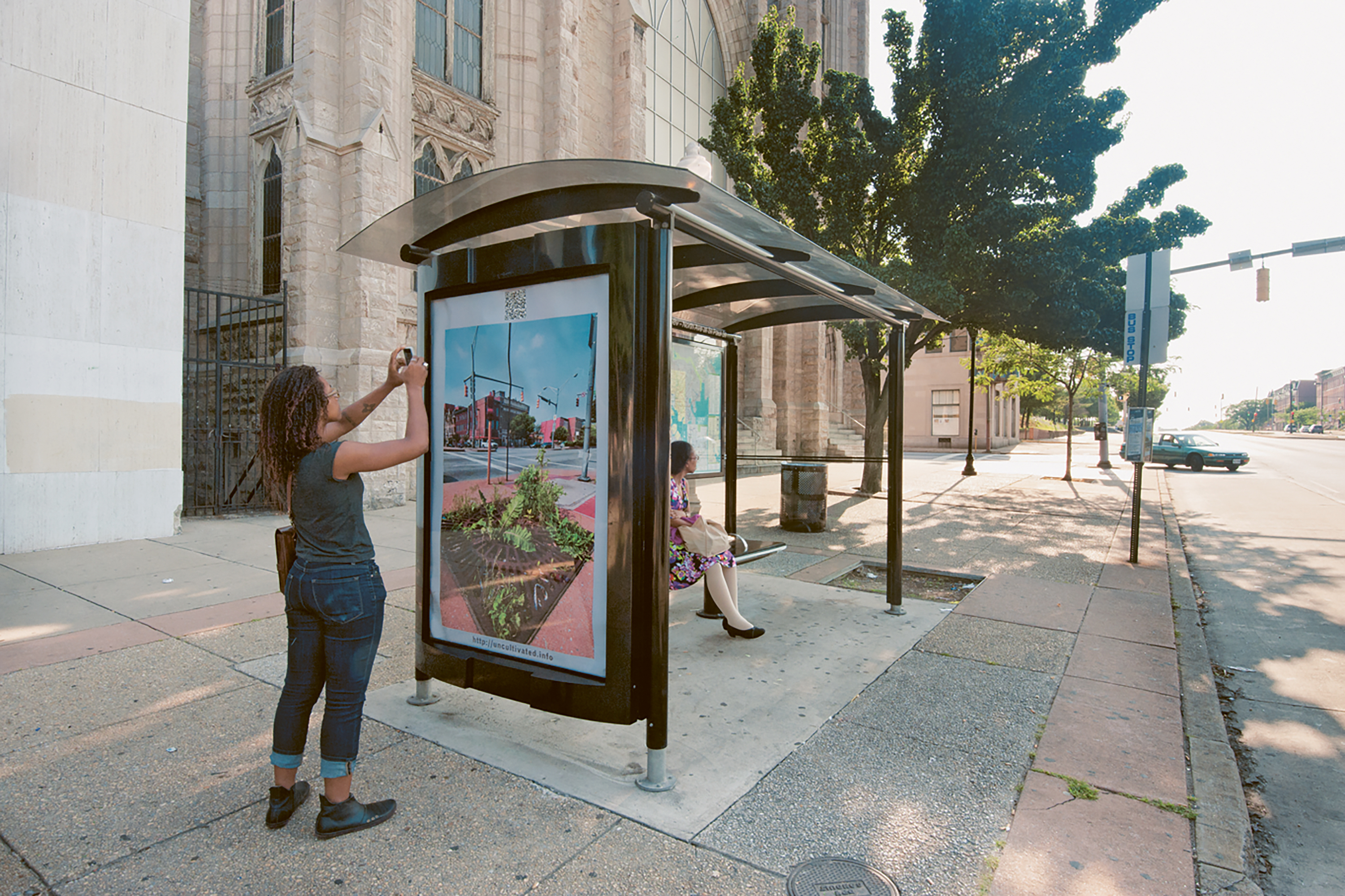 Demonstration of site specific poster for transit shelter, North Avenue, Baltimore, 2011. Art by Lynn Cazabon from the series Uncultivated.