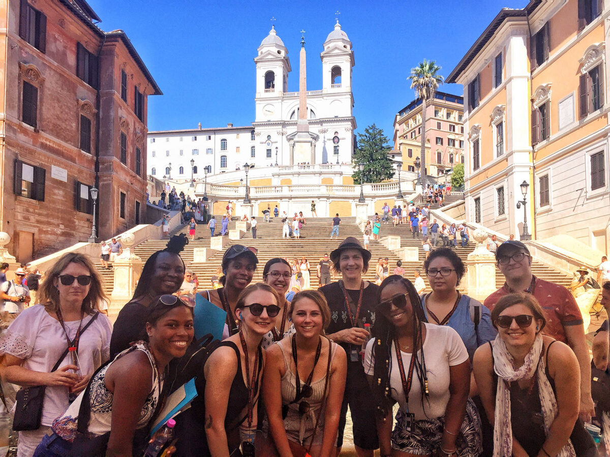 Students enjoy the sunshine on a summer trip to Italy.