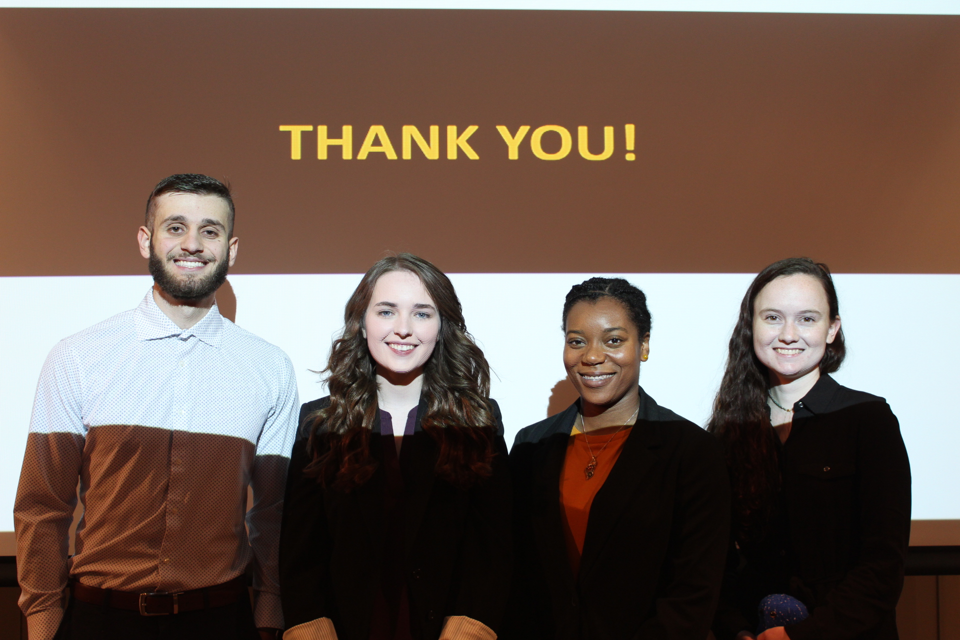 Four students standing in front of