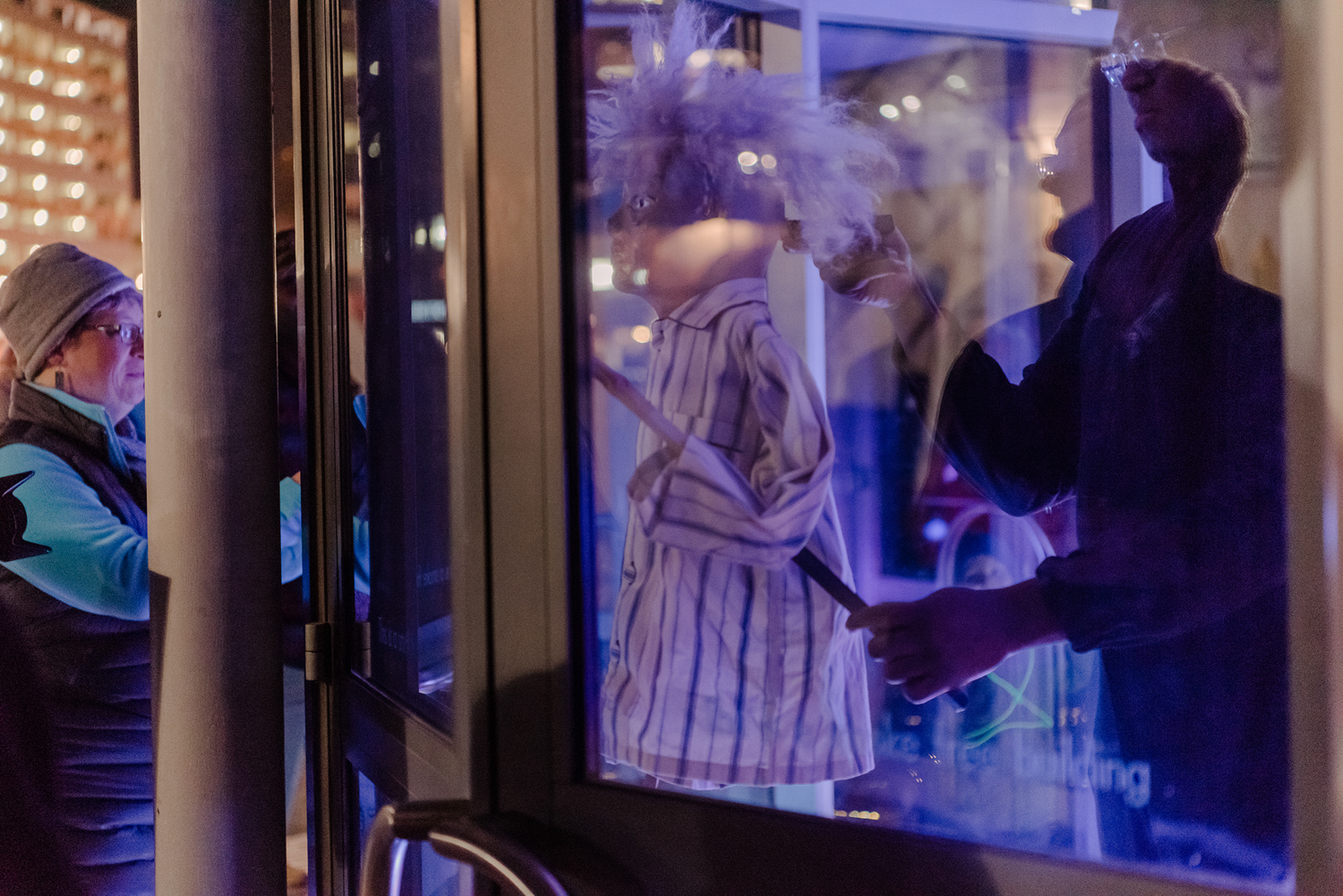 puppet show through a window
