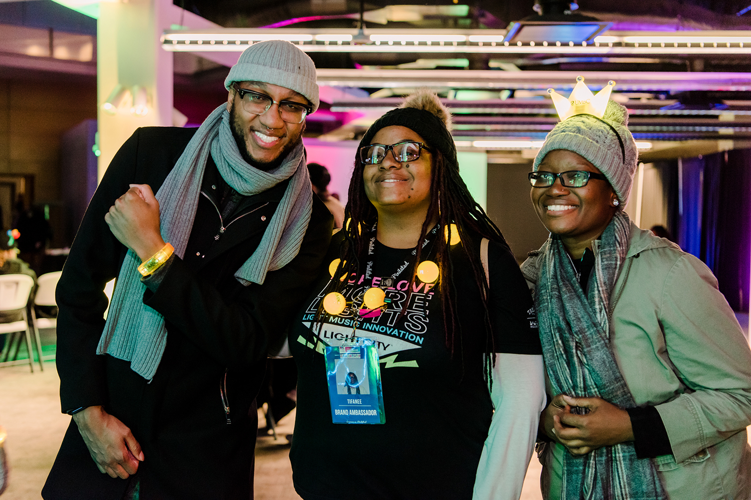Three people having fun at light city