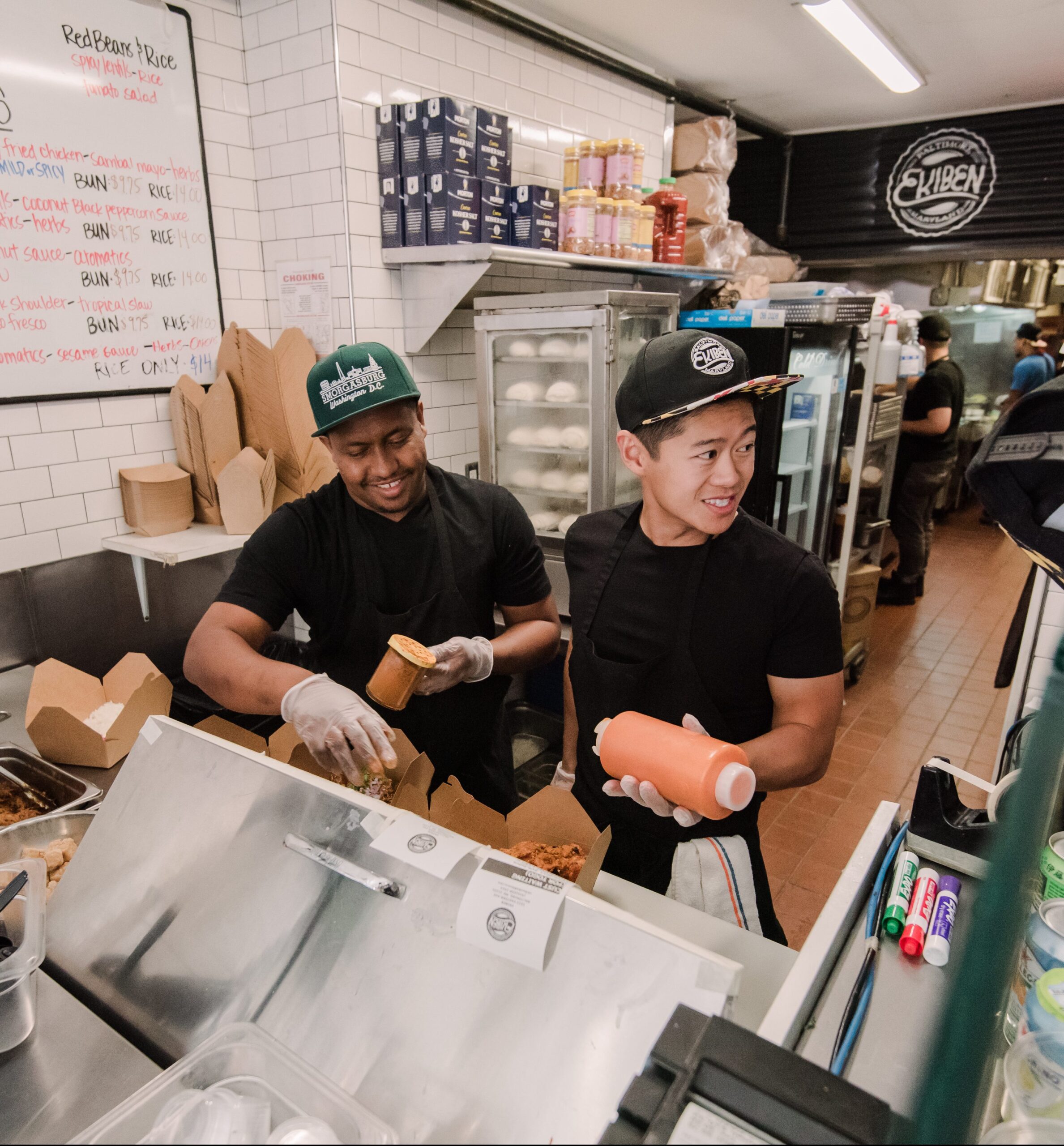 Steve Chu and Ephrem Abebe take a moment to pause in their Fells Point storefront.