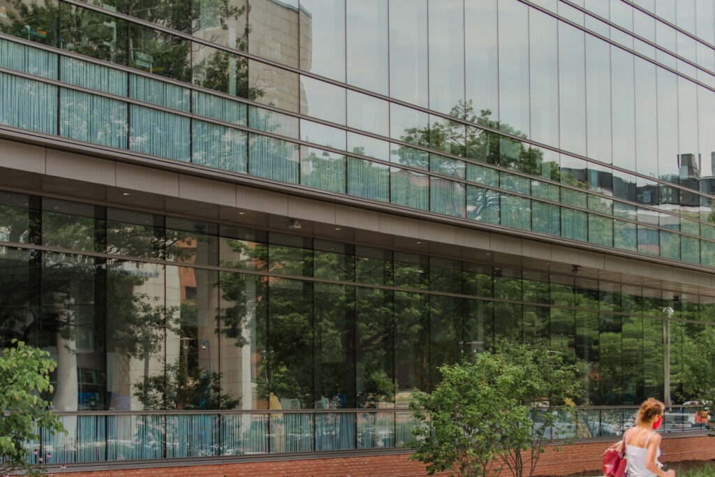 Reflective windows of a science building, as seen from the outside.