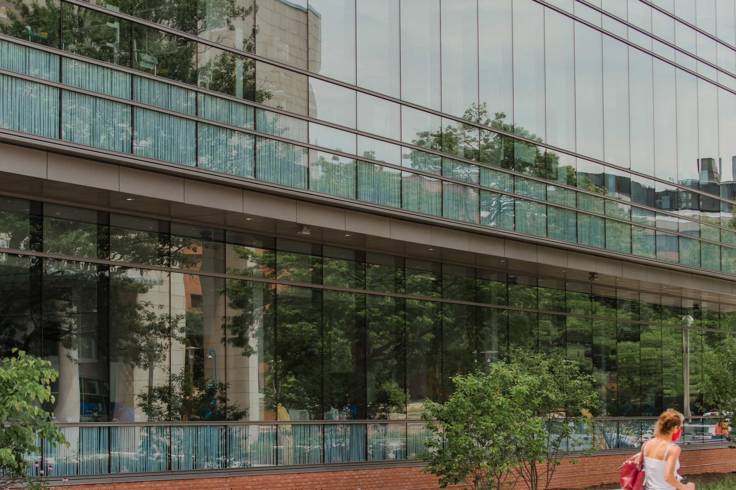 Reflective windows of a science building, as seen from the outside.