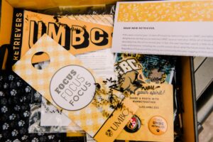 UMBC spirit pack with pins, stickers, and other giveaways