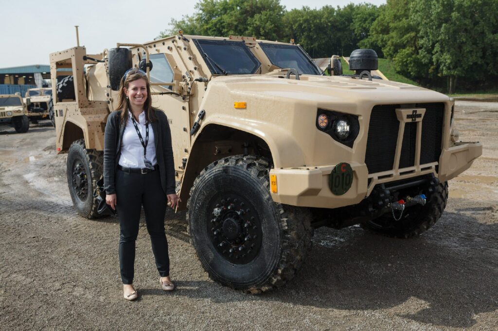 DeBlase visiting Oshkosh, a company she covers that makes defense vehicles, among other things. Photo courtesy of DeBlase.
