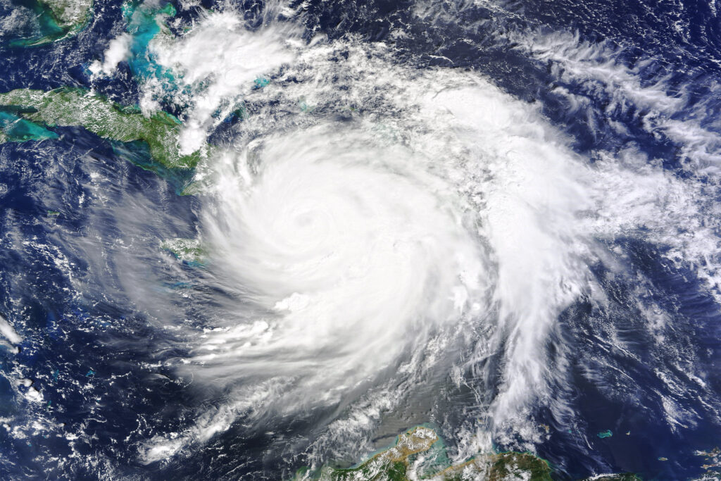 a swirling white storm over ocean and islands