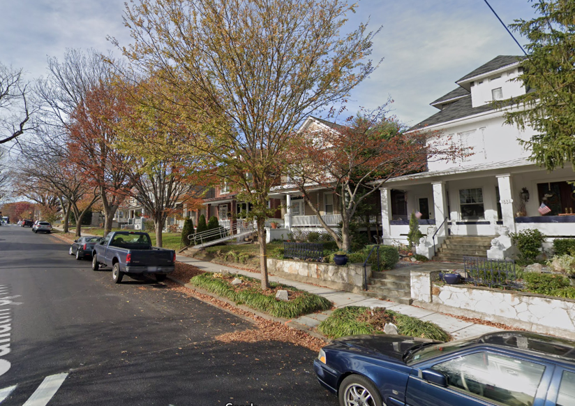 A neighborhood street of single family homes.