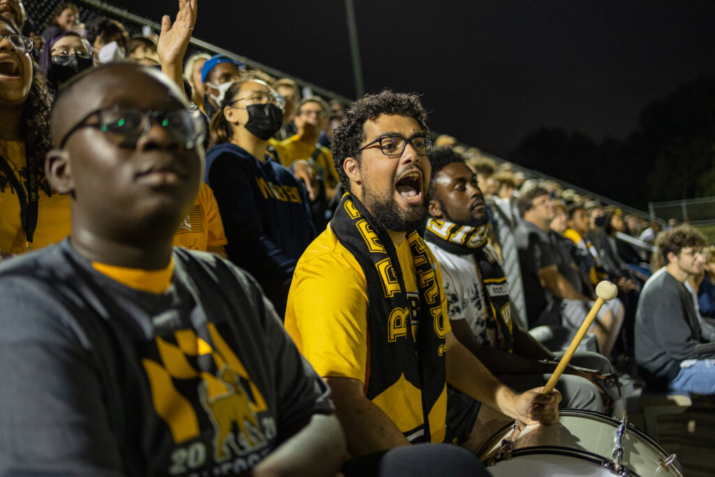 Fans giving it their all at a October soccer game.