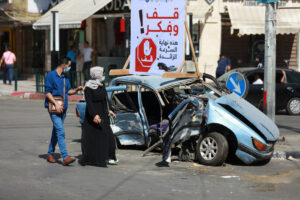 street scene in Gaza City with crash and injuries