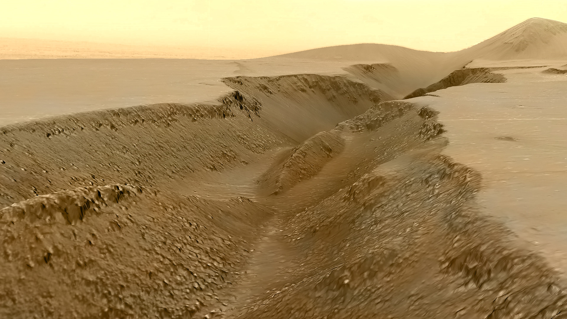 a sandy landscape, with a deep ditch down the middle