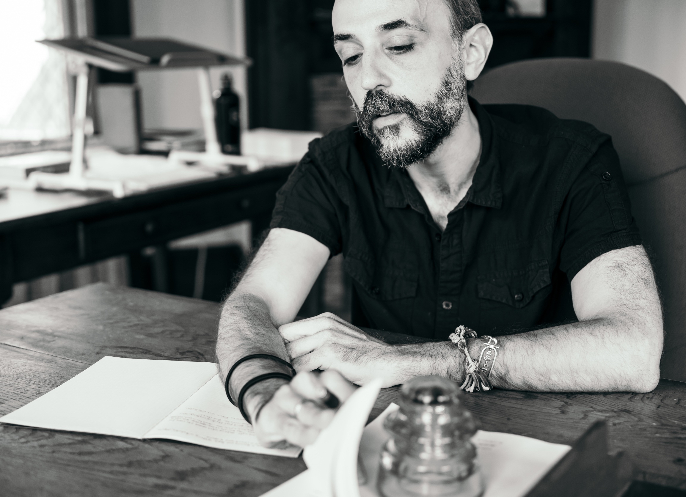 A writer sits at their desk Guggenheim
