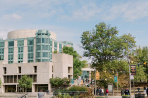 UMBC's campus, featuring the AOK library and gold and black flags