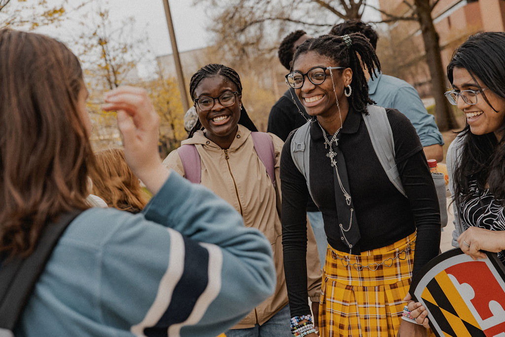 a diverse group of students chatting outside