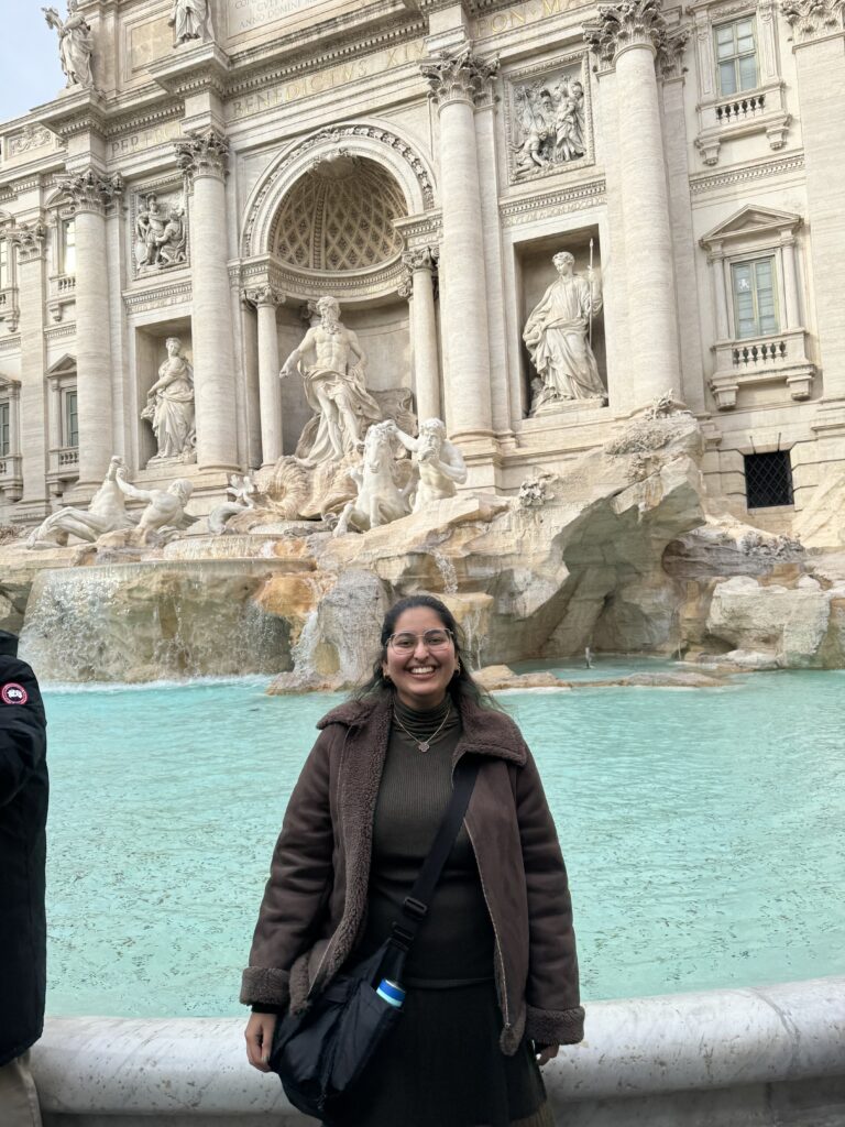 Ayra Sangi, a college student, stands in front of the Trevi Fountain in Rome Italy