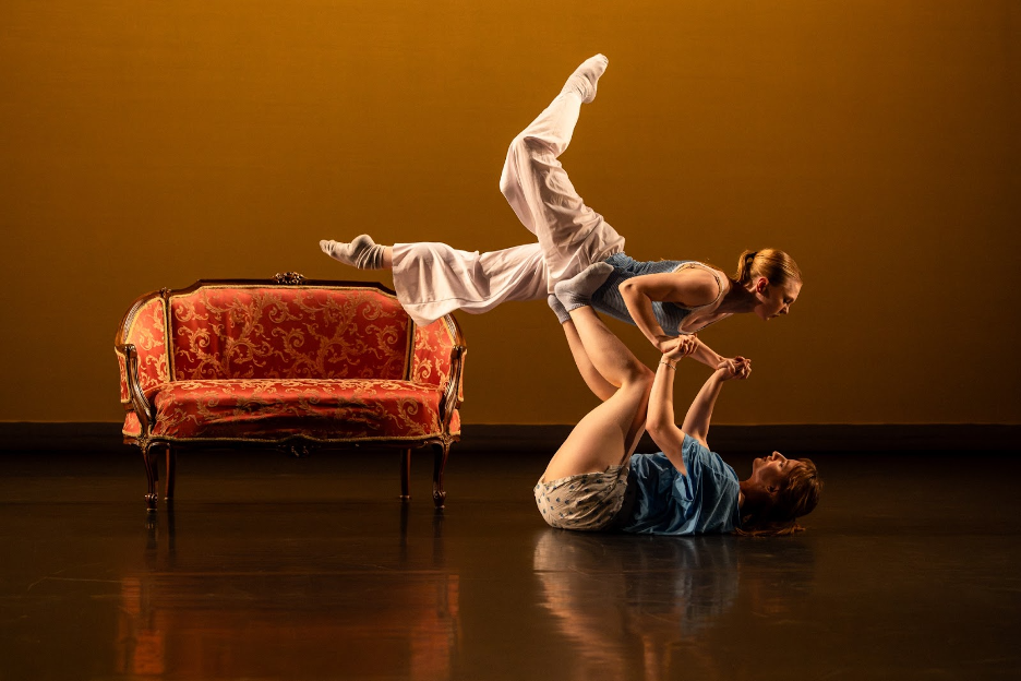 Dancers perform on stage.