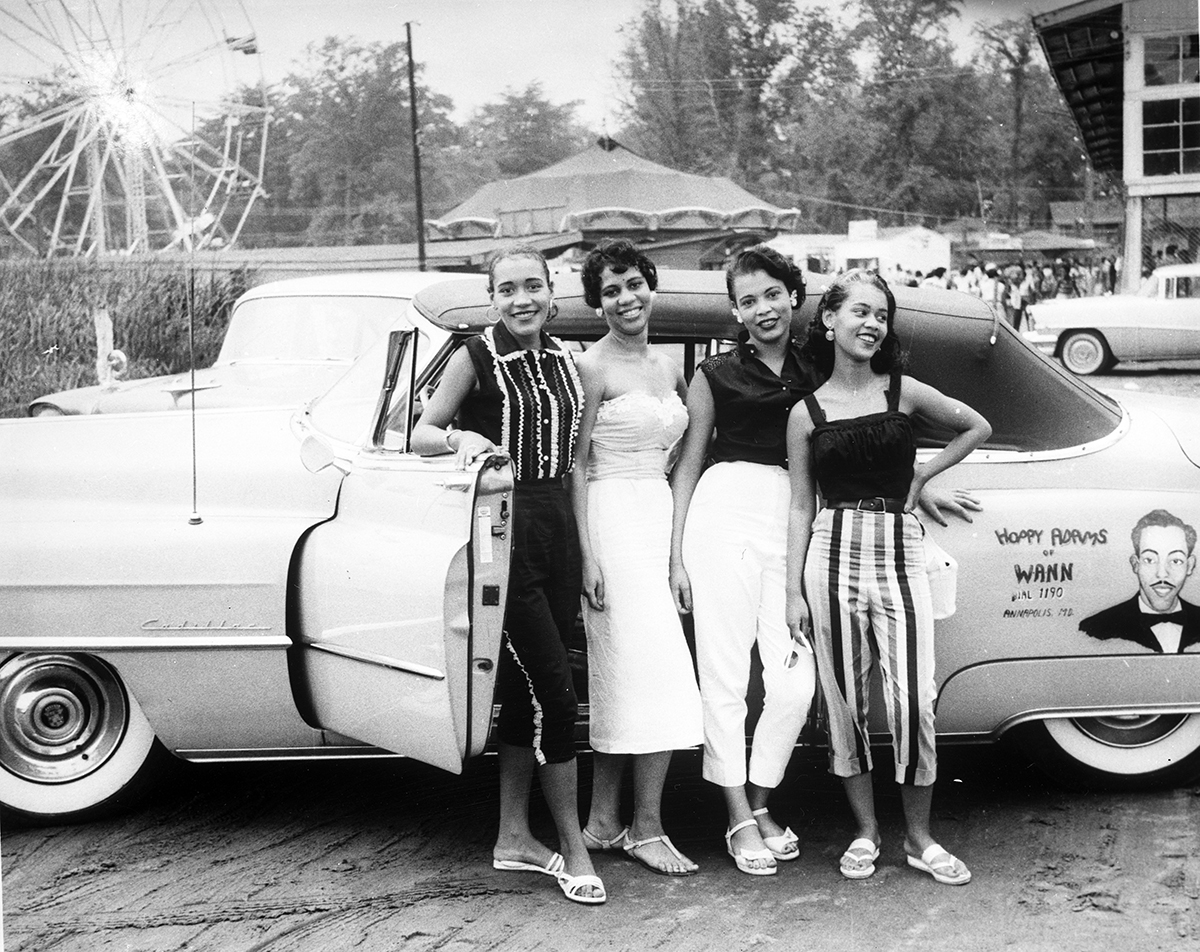 Photographer Unknown, Four women standing in front of car parked at Carr’s Beach, ca. 1950s/ early 1960s. Courtesy of the Maryland State Archives.