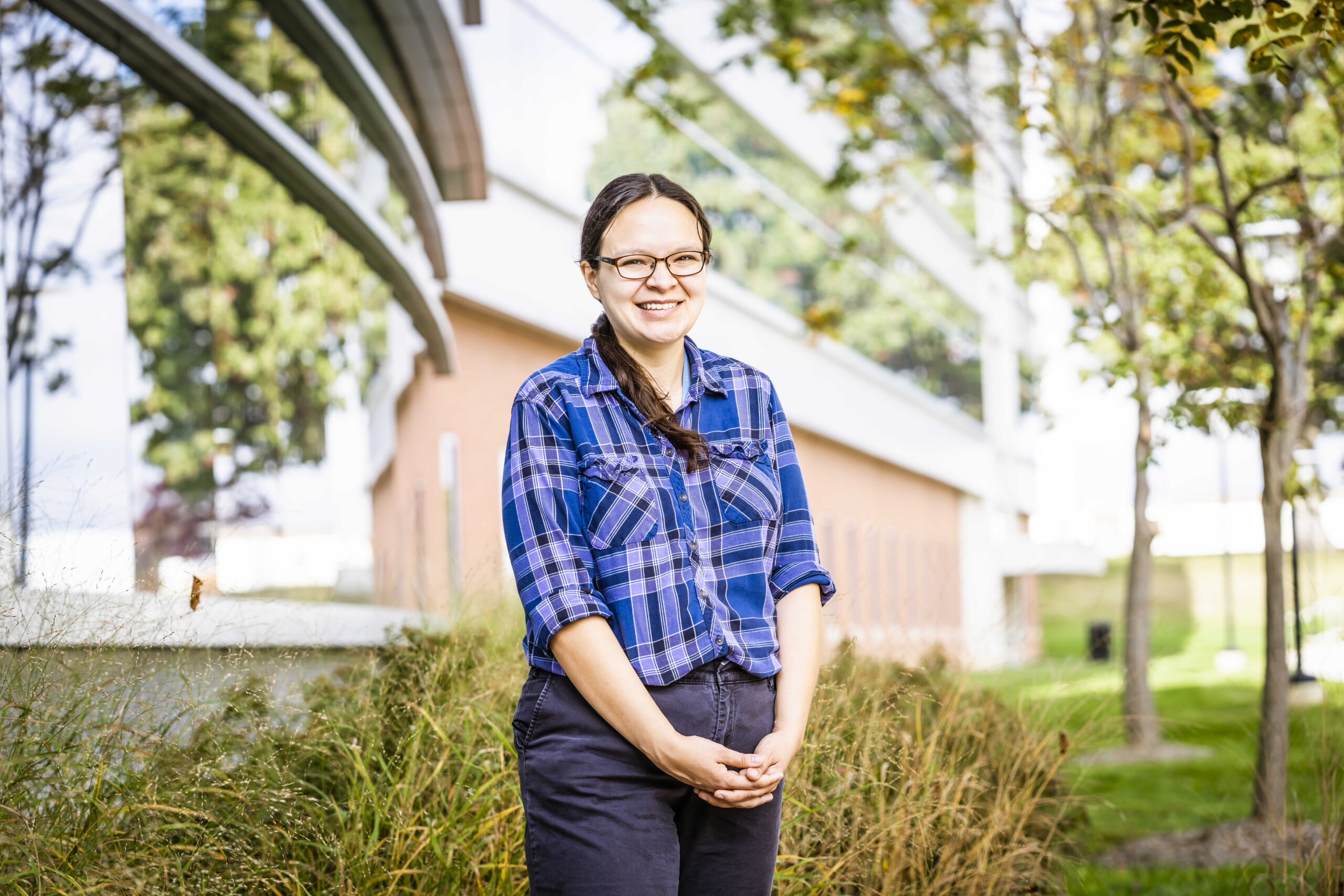 Emily Brown posed outdoors in front of a building