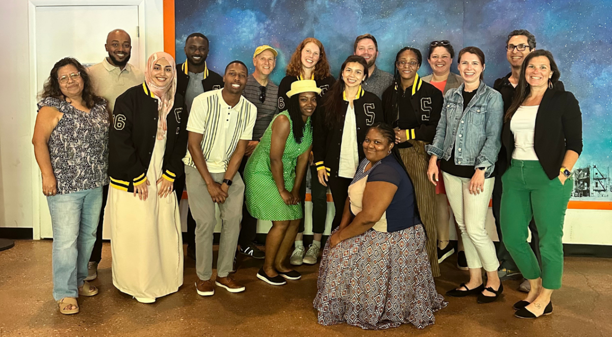 The Sherman Center staff celebrating two members graduating with their master's degrees in May 2025.