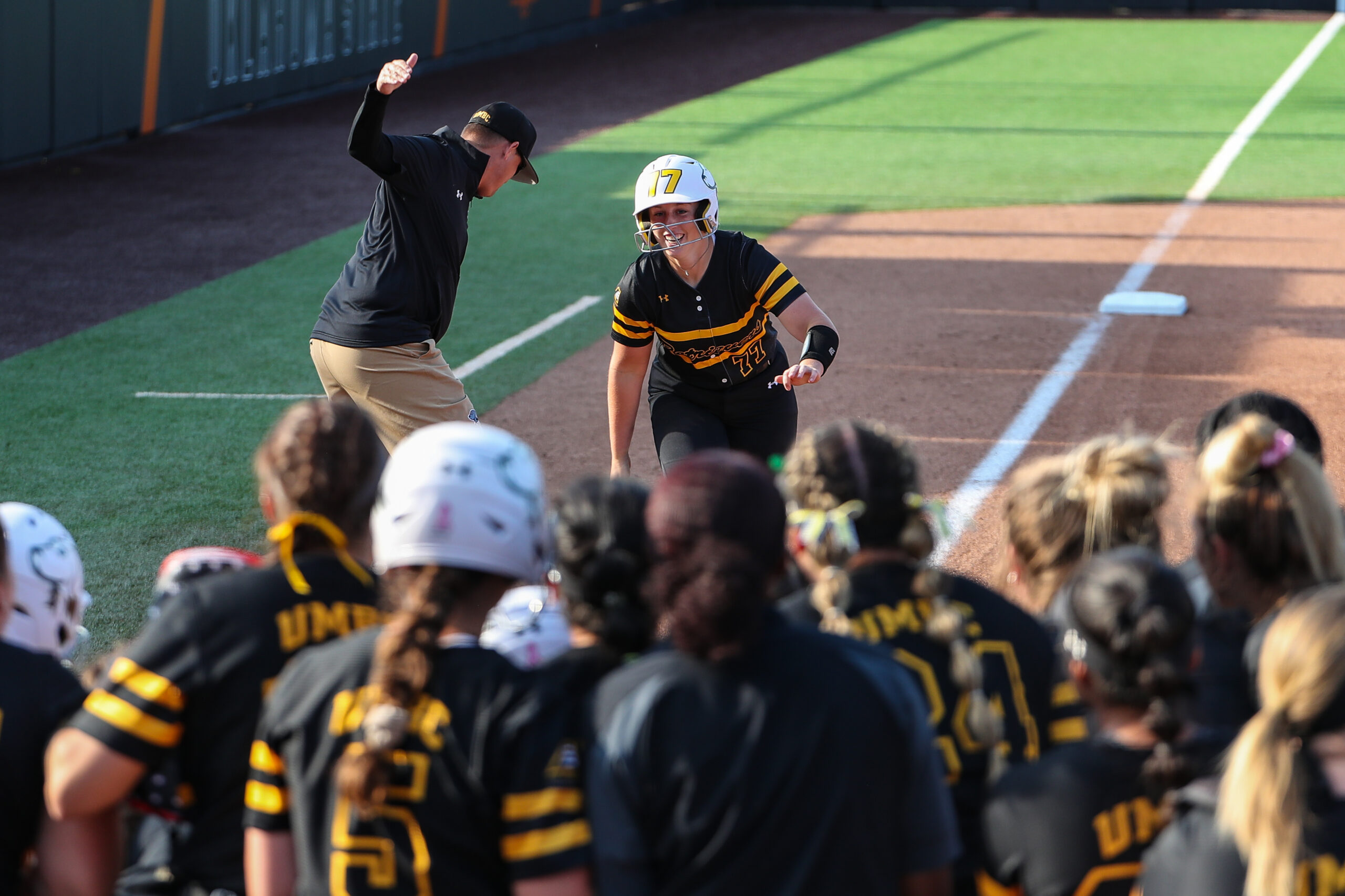 Playing softball and excelling in the hard sciences, Emily Riggs ’26, is knocking it out of the park