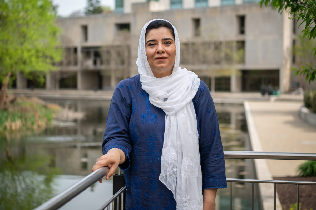 Maleeha Ahmed, social work student, stands in front of the Albin O. Kuhn library
