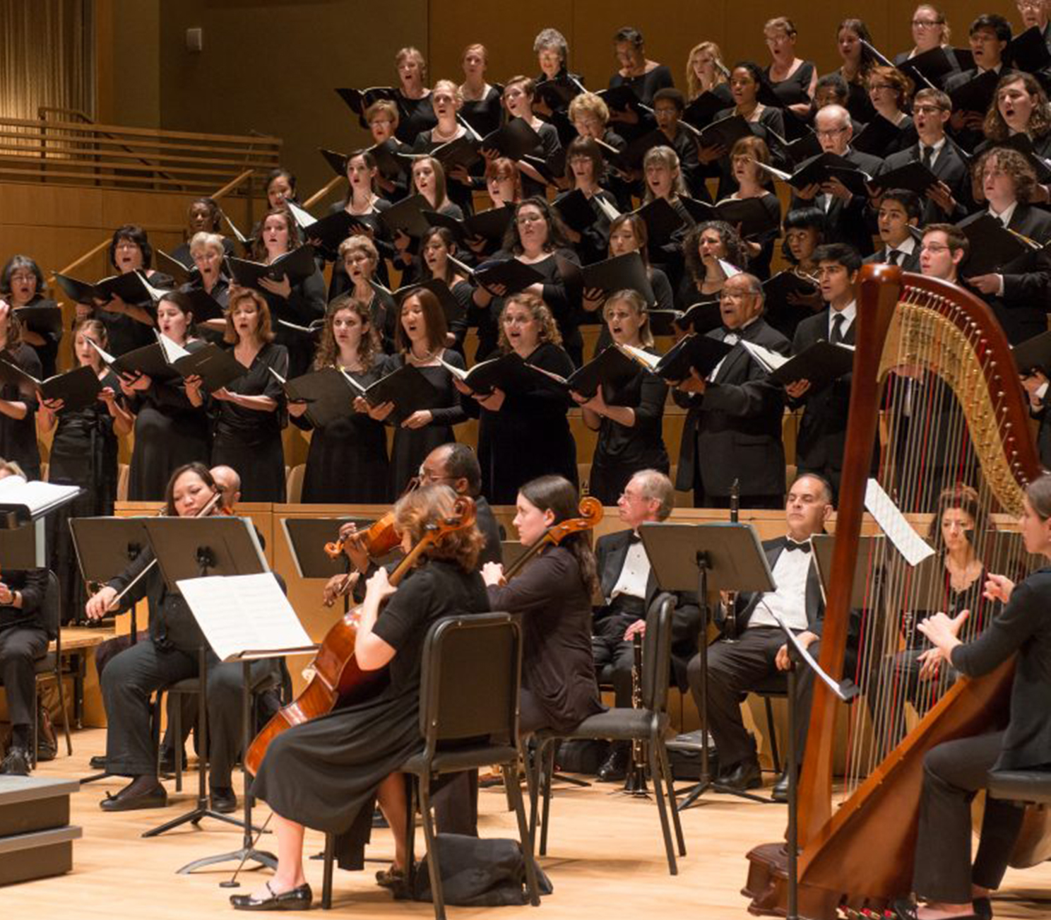 A chorus performs on stage.