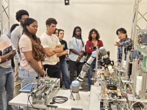 UMBC CWIT Scholars during a lab visit to Dr. Nilanjan Banerjee's lab in Fall 2025. The lab is the CREM – Center for Research in Emergent Manufacturing.